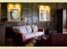 Lounge area with restored Oak panelling, the Watley Manor House